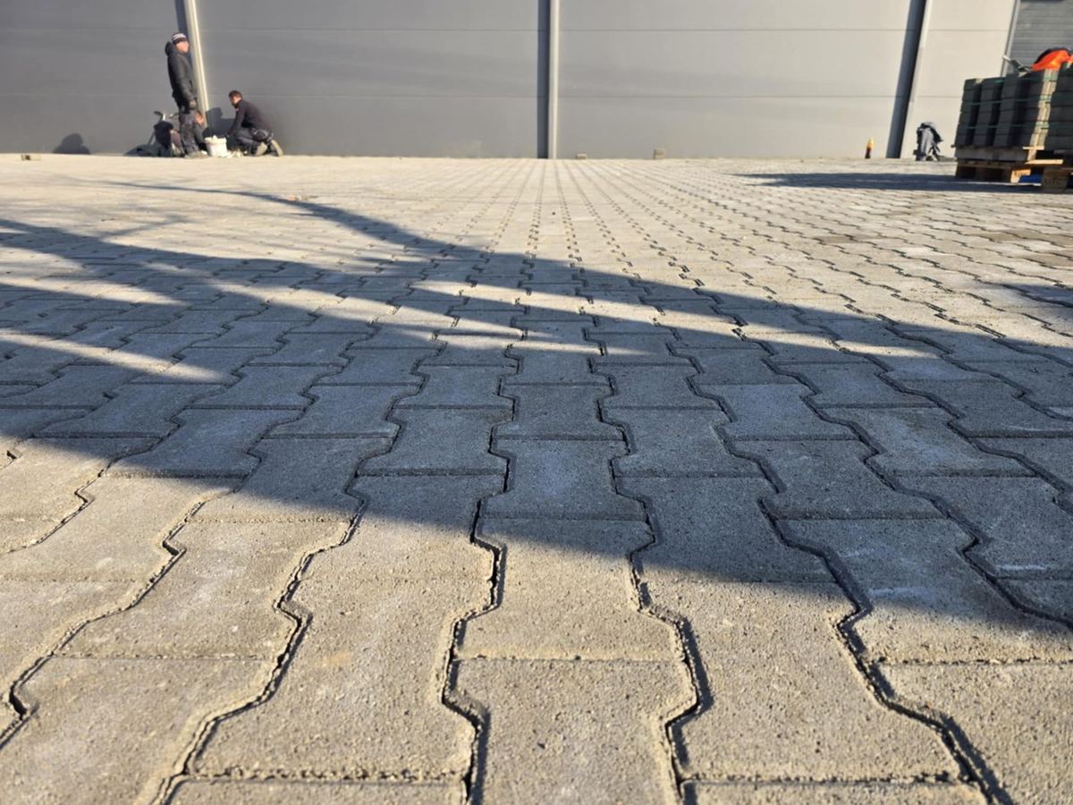 Finished double-T pavers with sand in the joints